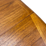 Load image into Gallery viewer, Close-up of a polished wooden surface showing the grain and a curved edge against a white background.
