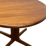 Load image into Gallery viewer, Close-up of a round wooden table top with a warm medium-brown finish and a matching pedestal base on a white background.
