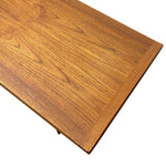 Load image into Gallery viewer, Close-up of a wooden tabletop corner showing a warm medium-brown wood grain finish and beveled edge on a white background.
