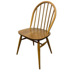 Load image into Gallery viewer, A mid-century modern wooden dining chair with a spindle back, square seat, and tapered legs, shown on a plain white background.
