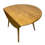 Load image into Gallery viewer, A mid-century modern wooden side table with a rounded, organic triangular top and four tapered legs, shown on a plain white background.
