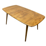 Load image into Gallery viewer, A mid-century modern wooden dining table with a rectangular extendable top and tapered legs, shown on a plain white background.
