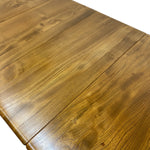Load image into Gallery viewer, Close-up of a wooden table top with visible grain and a fold-out leaf design, photographed on a white background.
