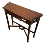 Load image into Gallery viewer, A dark brown wooden console table with ornate carved details on the apron and legs, shown from an elevated angle against a plain white background.
