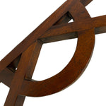Load image into Gallery viewer, Close-up detail of a dark brown wooden chair frame showing the interlocking geometric curves and grain texture against a plain white background.
