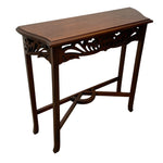 Load image into Gallery viewer, A dark brown wooden console table with ornate carved details under the tabletop and a curved X-shaped stretcher base, shown on a plain white background.
