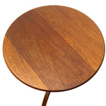 Load image into Gallery viewer, A round wooden side table top with a warm medium-brown finish and visible wood grain, shown against a plain white background.

