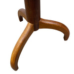 Load image into Gallery viewer, Close-up of a wooden three-legged stand or table base with a warm medium-brown finish, isolated on a white background.
