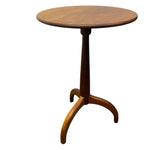 Load image into Gallery viewer, A mid-century modern wooden pedestal table with a round top, turned central stem, and three curved legs, shown on a plain white background.

