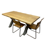 Load image into Gallery viewer, A live-edge wood dining table with two modern chairs featuring light wood seats and black metal frames, shown on a plain white background.
