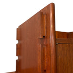 Load image into Gallery viewer, Close-up of a reddish-brown wooden furniture piece showing a drawer front with recessed handles and a matching wood grain surface against a white background.
