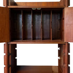 Load image into Gallery viewer, A close-up of a wooden cabinet or organizer with two doors open, revealing five vertical storage compartments inside. The wood has a warm reddish-brown finish, and the interior is shown against a plain white background.
