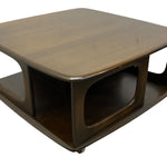 Load image into Gallery viewer, A mid-century modern wooden coffee table with a glossy dark brown finish, featuring a square top, open side compartments, and a lower shelf, shown on a plain white background.
