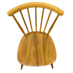 Load image into Gallery viewer, A mid-century modern wooden chair with a curved backrest, vertical spindle legs, and a rounded seat, shown from a top-down angle on a white background.
