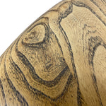 Load image into Gallery viewer, Close-up of a curved wooden surface with prominent natural wood grain patterns in warm tan and dark brown tones against a white background.

