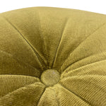 Load image into Gallery viewer, Close-up of a round upholstered cushion or stool top in a textured olive-gold fabric with radiating stitched panels and a button tuft in the center.
