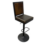 Load image into Gallery viewer, A modern bar stool with a dark brown textured upholstered seat and backrest, a black metal frame, and a round black base on a white background.
