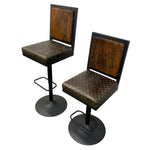 Load image into Gallery viewer, Two vintage-style bar stools with dark brown quilted patterned seats and backs, black metal frames, and round black bases, shown on a plain white background.
