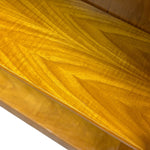 Load image into Gallery viewer, Close-up of a polished wood surface with a warm golden-brown finish and visible grain pattern.
