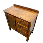 Load image into Gallery viewer, A vintage wooden writing desk or cabinet with three drawers and a door, featuring a rich walnut-like wood grain finish and brass handles, shown on a plain white background.

