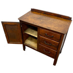 Load image into Gallery viewer, A vintage wooden writing desk or cabinet with an open door, three drawers, and two interior shelves, shown on a plain white background.

