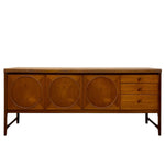 Load image into Gallery viewer, Mid-century modern wooden sideboard with three large circular inset panels on the left and three drawers on the right, supported by angled metal legs, shown against a plain white background.
