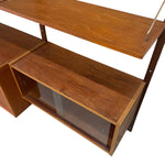 Load image into Gallery viewer, Mid-century modern wooden console shelf with a warm brown wood grain finish, featuring a glass-front lower cabinet and open shelving, shown on a white background.
