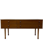 Load image into Gallery viewer, Wooden dresser with four drawers on a white background
