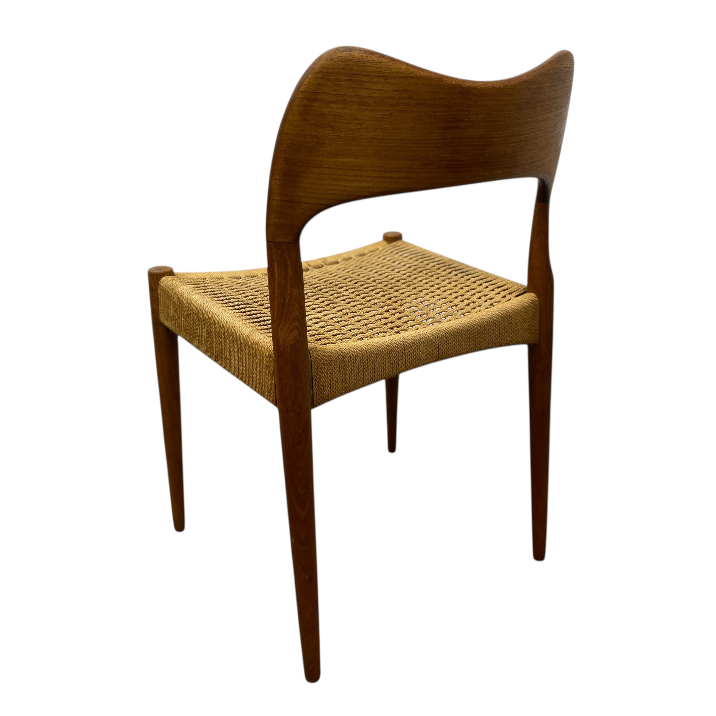 Wooden chair with woven seat on a white background