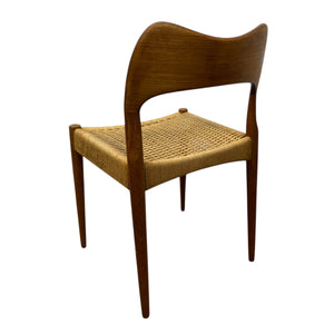 Wooden chair with woven seat on a white background