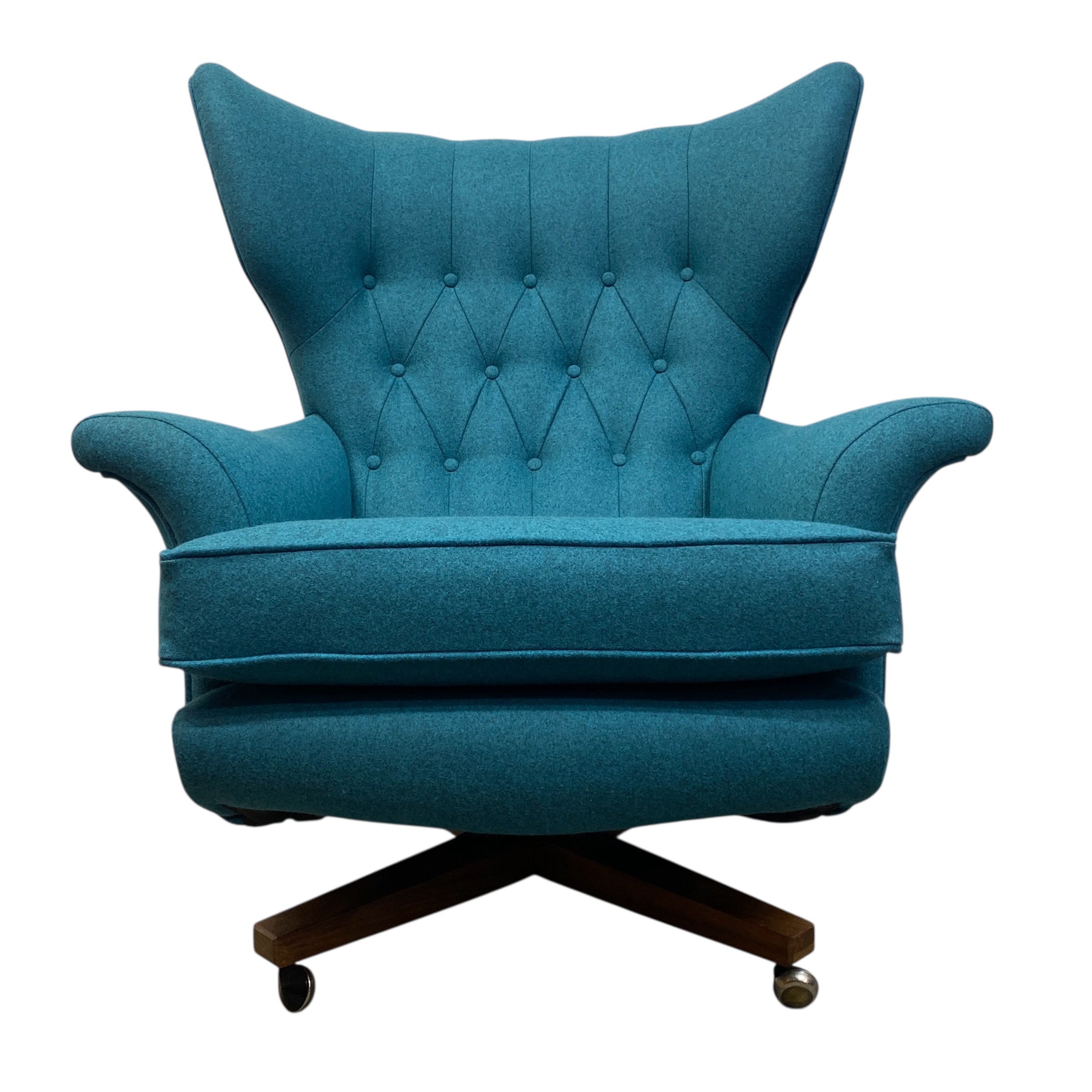Blue armchair with tufted backrest on a white background