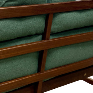 Green cushioned bench with wooden slats on a white background