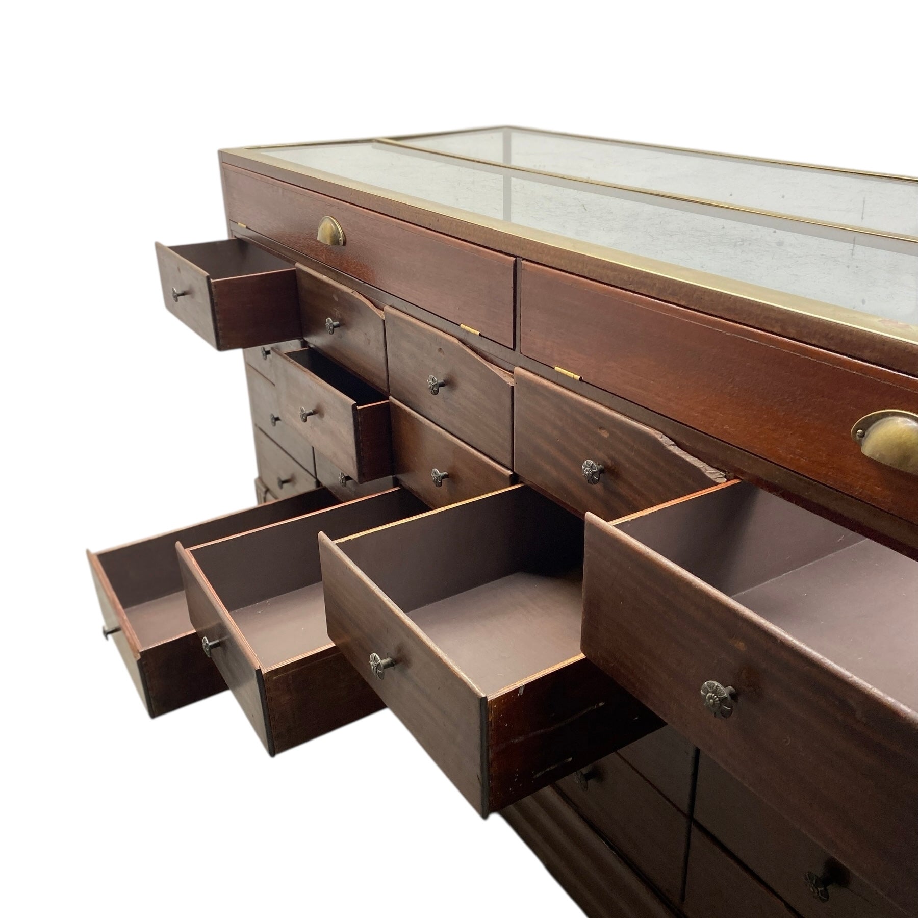 Wooden display case with open drawers on a white background