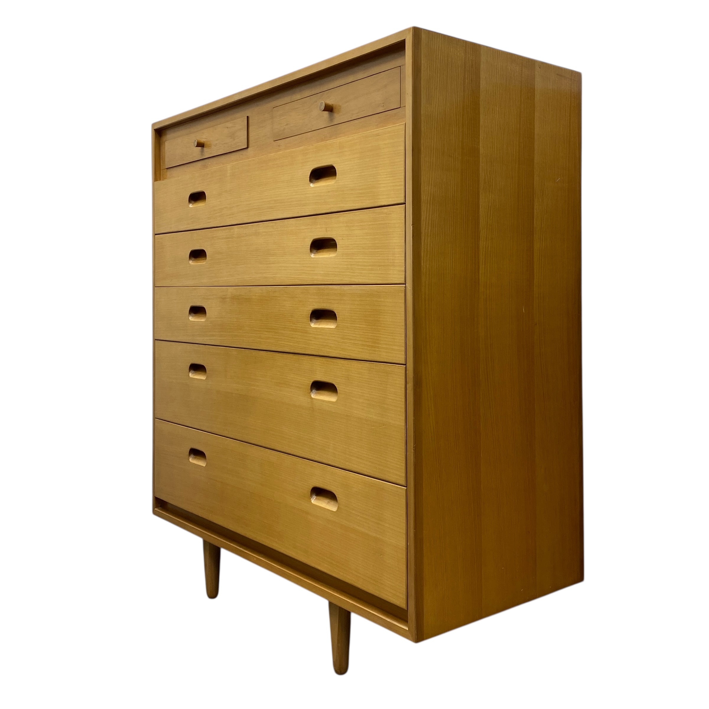 Wooden dresser with multiple drawers on a white background