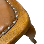 Load image into Gallery viewer, Close-up of a wooden stool with brown leather seat and silver studs on a white background
