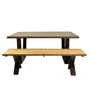 Wooden dining table with benches on a white background