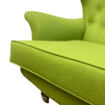 Load image into Gallery viewer, Close-up of a green armchair with a blurred background

