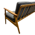 Load image into Gallery viewer, Wooden chair with grey cushions on a white background
