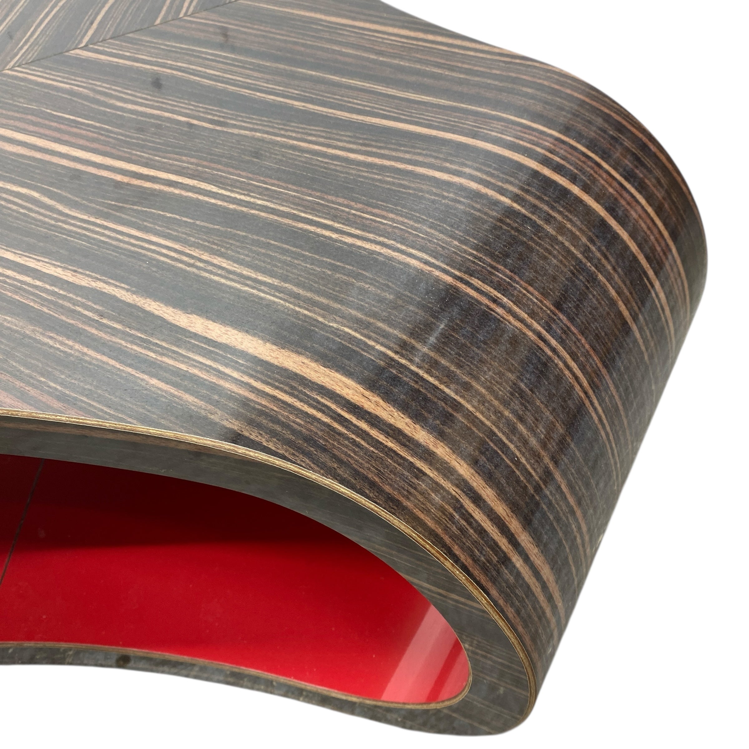 Wooden surface with red interior on a white background