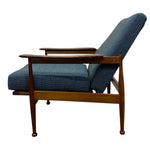 Load image into Gallery viewer, Blue upholstered chair with wooden frame on a white background
