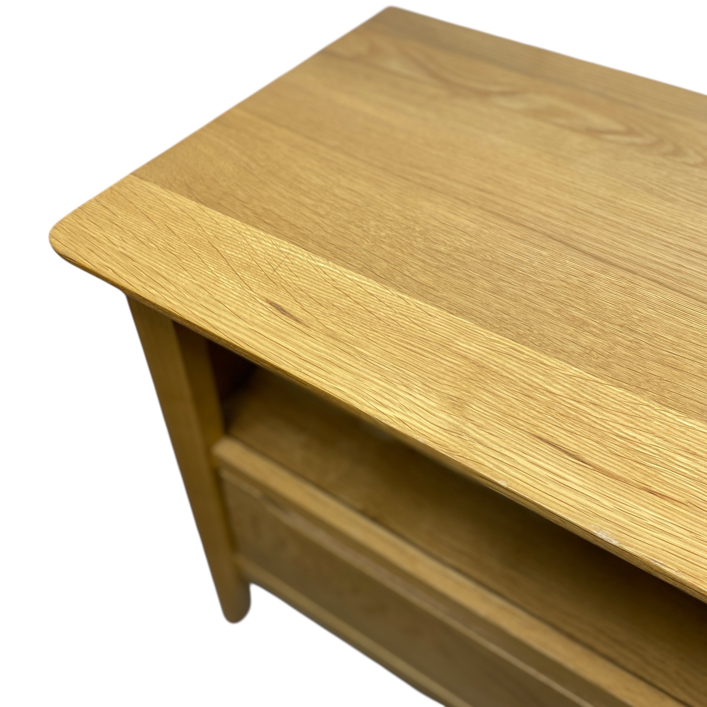 Wooden media unit with a single drawer on a white background