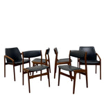 Load image into Gallery viewer, Set of six black chairs with wooden frames on a white background
