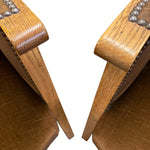 Load image into Gallery viewer, Close-up of wooden stools with leather seats and metal studs on a white background
