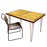 Load image into Gallery viewer, Wooden table with metal legs and a chair on a white background
