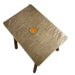 Load image into Gallery viewer, Small pewter table with a textured surface and an orange stone on a white background
