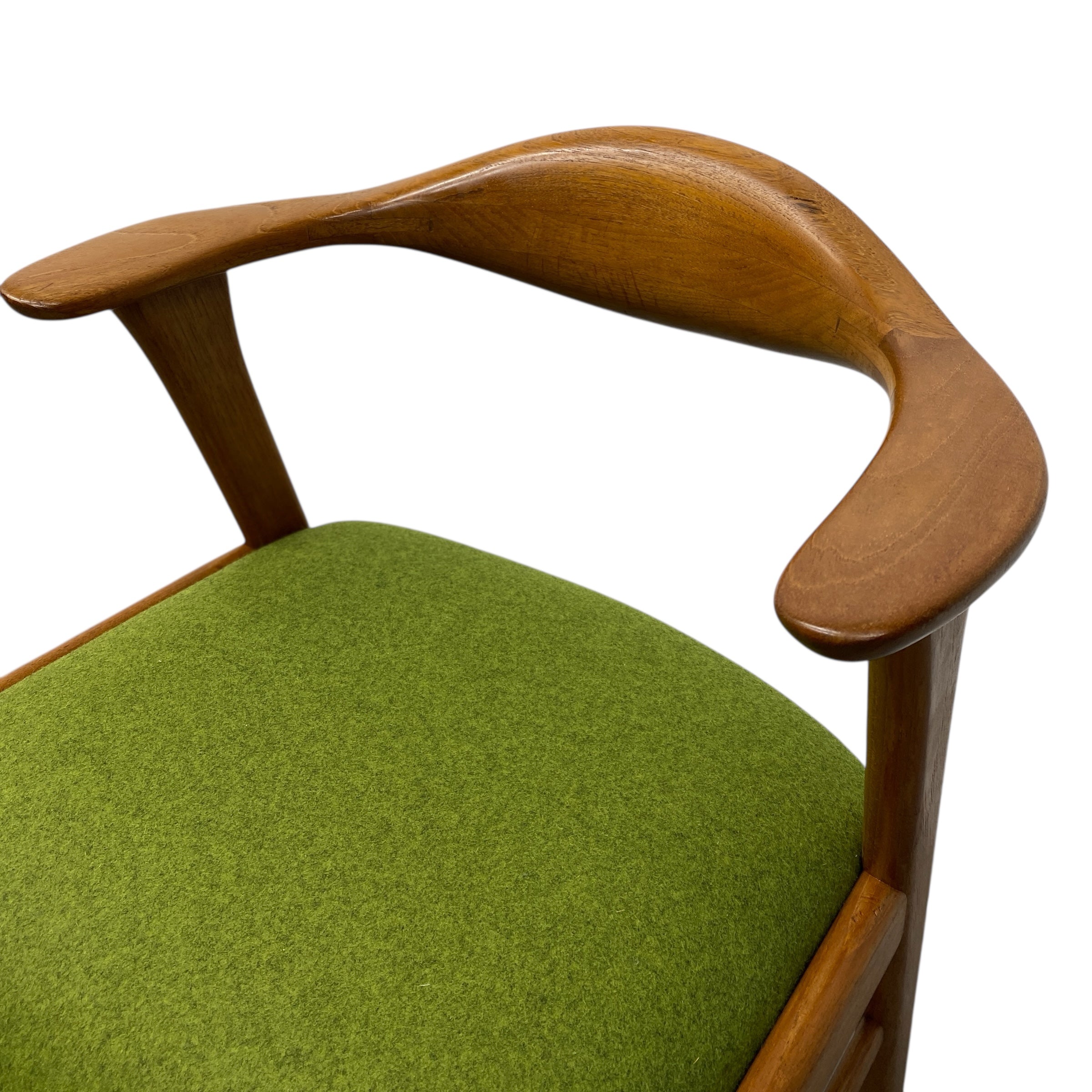 Chair with wooden armrests and green cushion on a white background