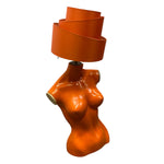 Load image into Gallery viewer, Orange lamp with a spiral shade on a white background
