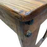 Load image into Gallery viewer, Close-up of a wooden stool with a metal bracket on a white background

