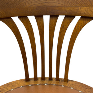 Wooden chair with slatted back on a white background