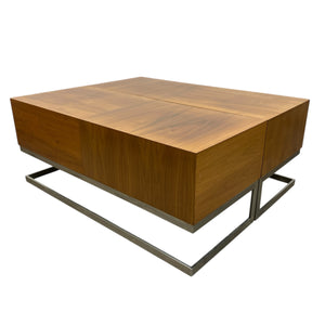 Wooden coffee table with metal base on a white background